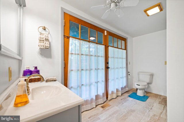 2436 Warm Springs Rd, Shenandoah Junction, WV 25442 - bathroom featuring vanity, toilet, and a ceiling fan
