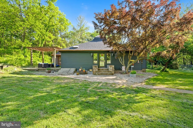 2436 Warm Springs Rd, Shenandoah Junction, WV 25442 - rear view of house featuring a yard, a pergola, and roof with shingles