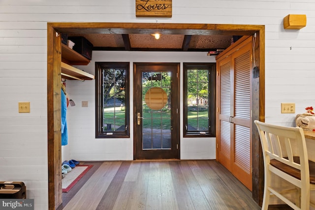 2436 Warm Springs Rd, Shenandoah Junction, WV 25442 - doorway to outside with wooden walls, hardwood / wood-style floors, and beam ceiling