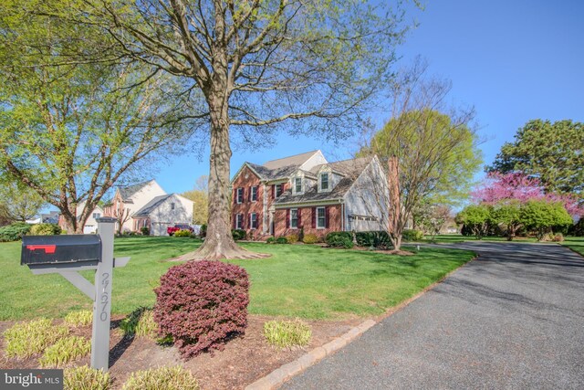 view of front of home with a front yard