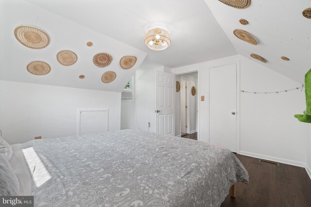13432 Forest Glen Rd, Woodbridge, VA 22191 - bedroom featuring visible vents, dark wood-style floors, and lofted ceiling