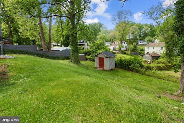 13432 Forest Glen Rd, Woodbridge, VA 22191 - view of yard featuring an outbuilding, fence, and a storage shed