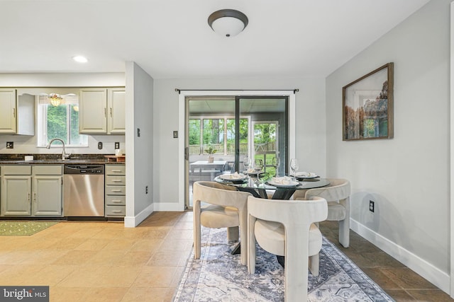 dining space featuring baseboards and recessed lighting
