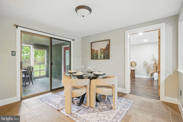 dining area featuring baseboards