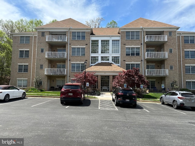 view of property with uncovered parking