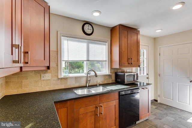 kitchen featuring tasteful backsplash, a sink, brown cabinets, dishwasher, and stainless steel microwave