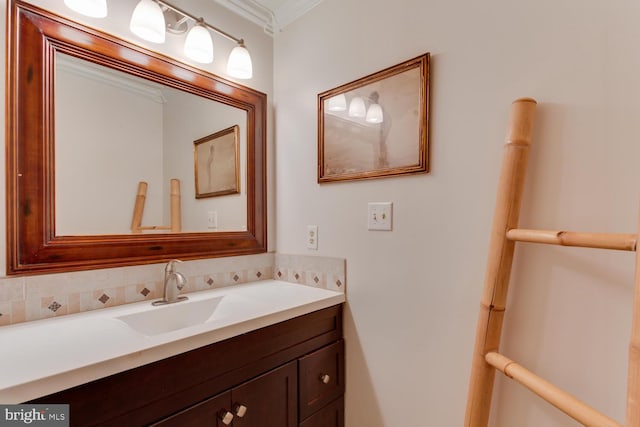 bathroom with vanity and ornamental molding