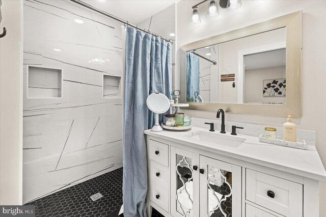 full bathroom featuring vanity and curtained shower