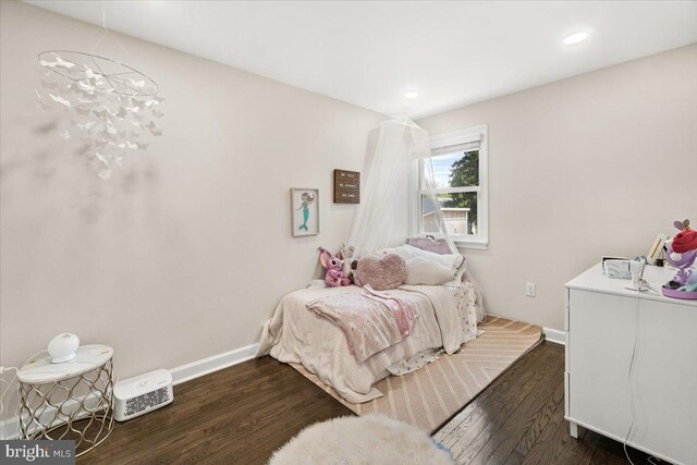 bedroom featuring baseboards, recessed lighting, and wood finished floors