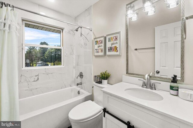 bathroom featuring vanity, toilet, and shower / tub combo
