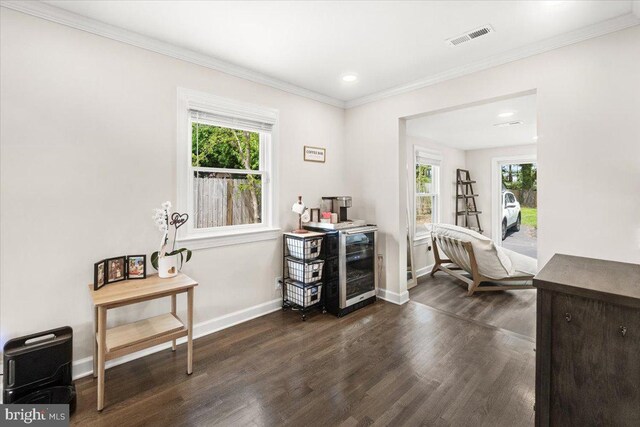 interior space with visible vents, crown molding, dark wood-style flooring, baseboards, and recessed lighting