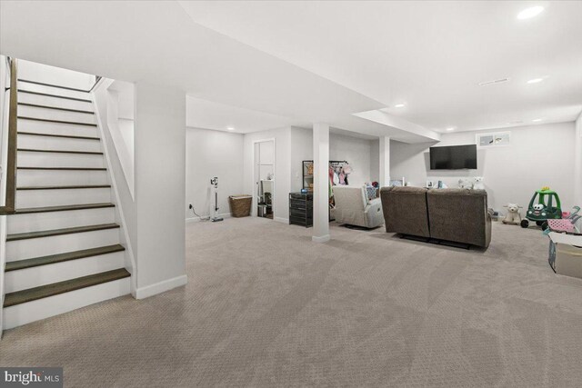 living area featuring recessed lighting, stairway, baseboards, and carpet