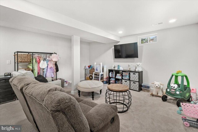 carpeted living area featuring recessed lighting and visible vents