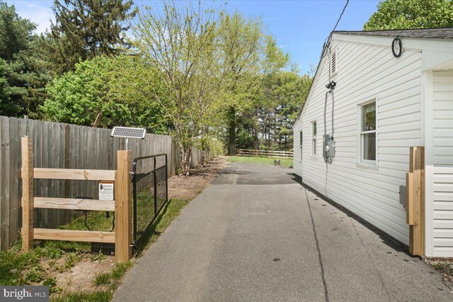 view of road with aphalt driveway