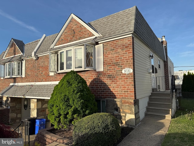 9881 Clark St, Philadelphia, PA 19115 - view of front of house with roof with shingles and brick siding