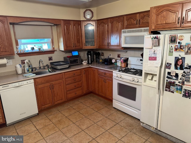 9881 Clark St, Philadelphia, PA 19115 - kitchen featuring tasteful backsplash, a sink, light countertops, white appliances, and light tile patterned flooring