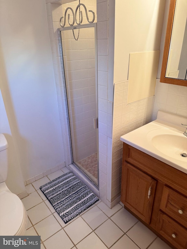 9881 Clark St, Philadelphia, PA 19115 - bathroom with tile patterned flooring, vanity, toilet, tile walls, and a stall shower
