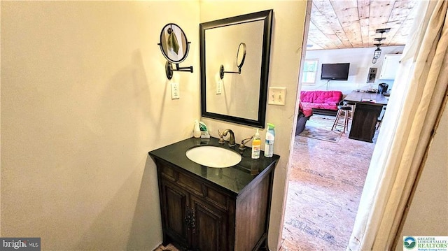 bathroom featuring wooden ceiling and vanity
