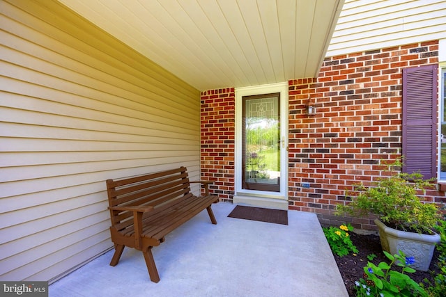 entrance to property with brick siding