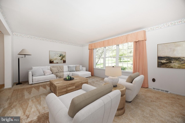 carpeted living area featuring visible vents