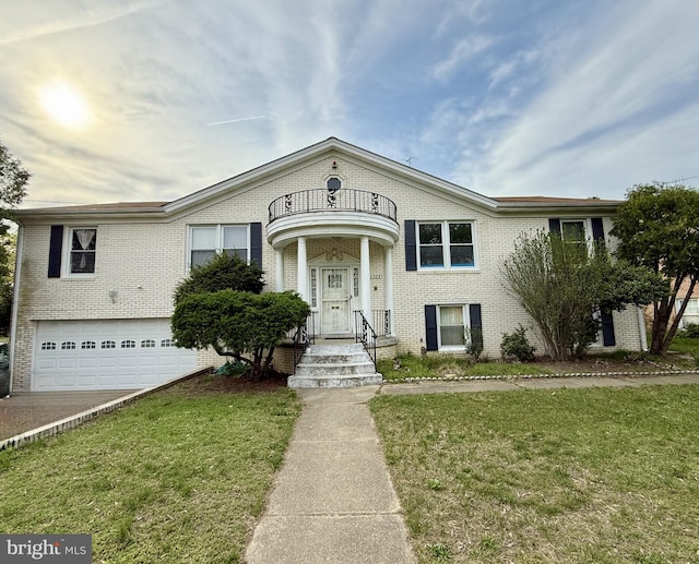 view of front of house featuring an attached garage, brick siding, a front yard, and a balcony