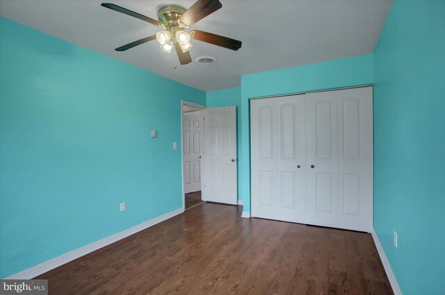 2284 Pine Rd, Newville, PA 17241 - unfurnished bedroom with visible vents, baseboards, a closet, ceiling fan, and dark wood-type flooring