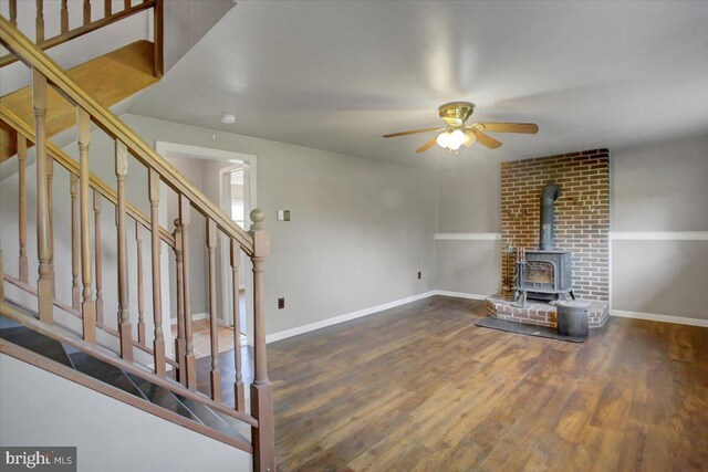 2284 Pine Rd, Newville, PA 17241 - unfurnished living room with stairway, baseboards, a ceiling fan, and a wood stove