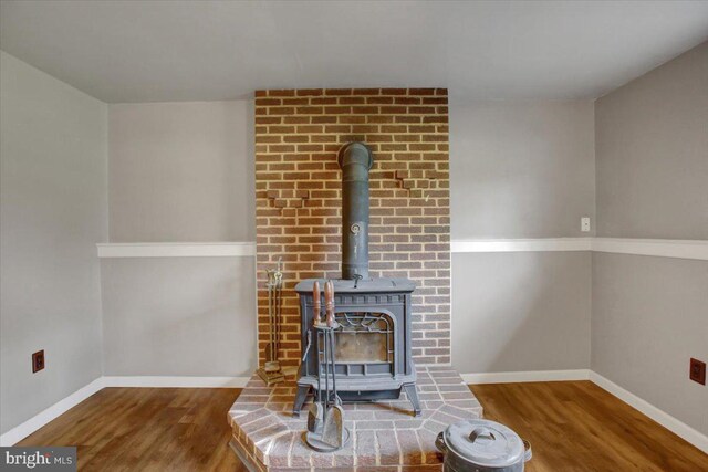 2284 Pine Rd, Newville, PA 17241 - room details with baseboards, wood finished floors, and a wood stove