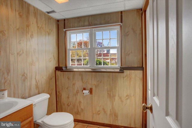 2284 Pine Rd, Newville, PA 17241 - bathroom featuring toilet, vanity, tile patterned floors, and wooden walls