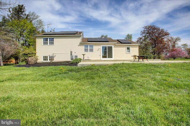 2284 Pine Rd, Newville, PA 17241 - rear view of property with a lawn, solar panels, and a patio area