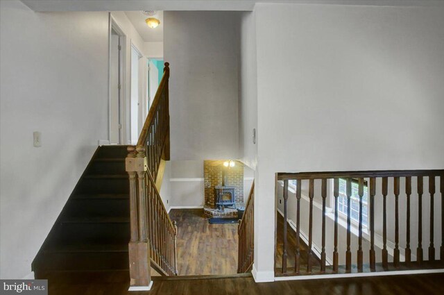 2284 Pine Rd, Newville, PA 17241 - stairway with baseboards, wood finished floors, and a wood stove