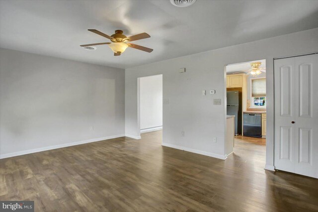 2284 Pine Rd, Newville, PA 17241 - empty room with arched walkways, a ceiling fan, baseboards, and dark wood-style flooring