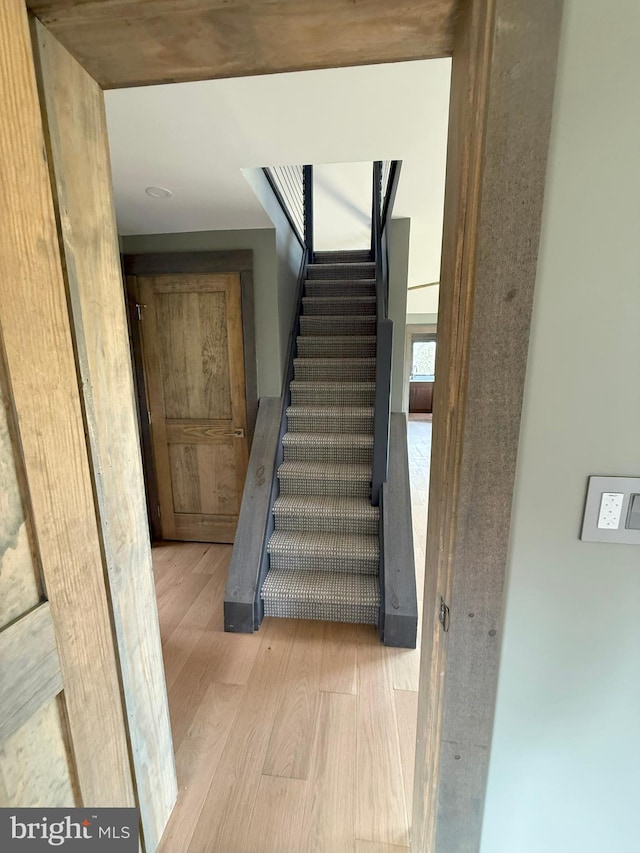 stairs with wood finished floors