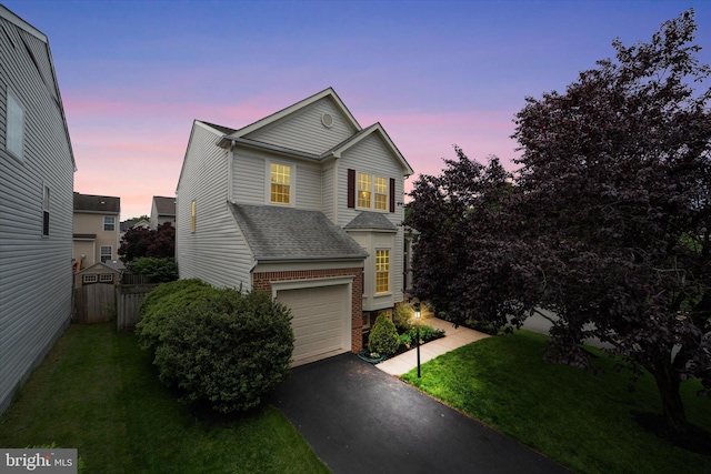 6780 Hollow Glen Ct, Gainesville, VA 20155 - traditional-style house featuring brick siding, an attached garage, asphalt driveway, and a shingled roof