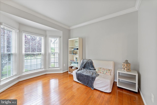 6780 Hollow Glen Ct, Gainesville, VA 20155 - living area featuring hardwood / wood-style flooring, ornamental molding, baseboards, and plenty of natural light