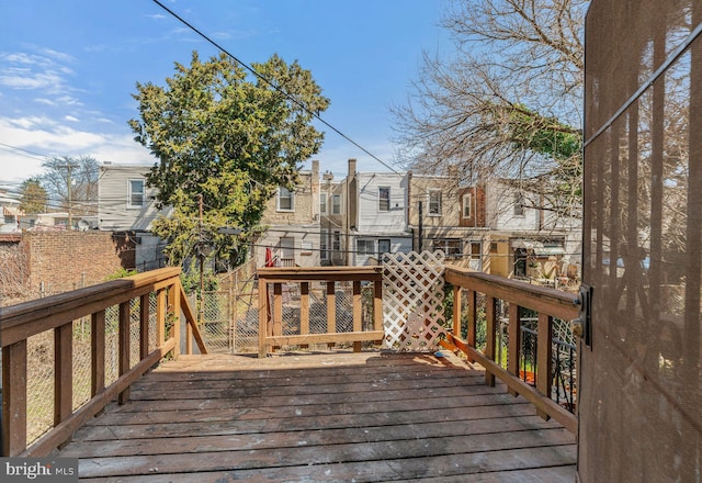 wooden terrace with a residential view