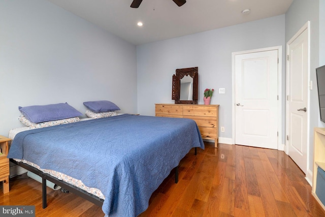 bedroom featuring recessed lighting, wood finished floors, baseboards, and ceiling fan