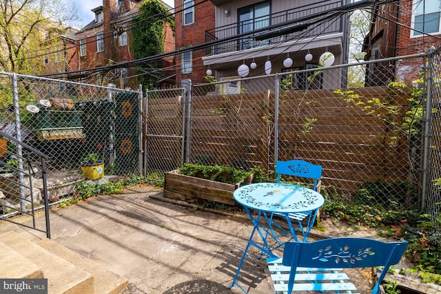 view of patio / terrace with fence