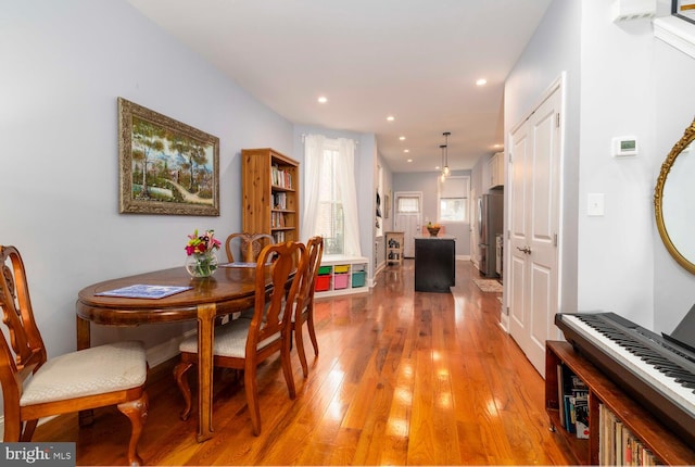 dining space featuring recessed lighting and light wood finished floors