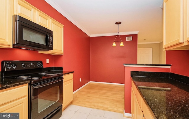 kitchen featuring crown molding, black appliances, hanging light fixtures, and visible vents