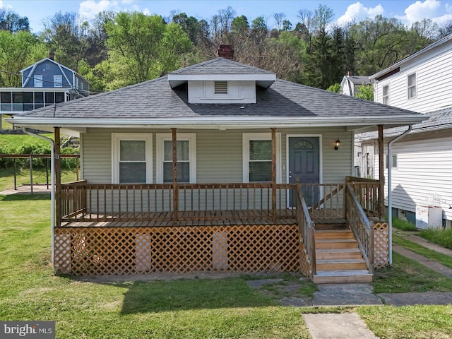 819 Manns Ter, Cumberland, MD 21502 - bungalow-style home featuring a porch, roof with shingles, a chimney, and a front yard
