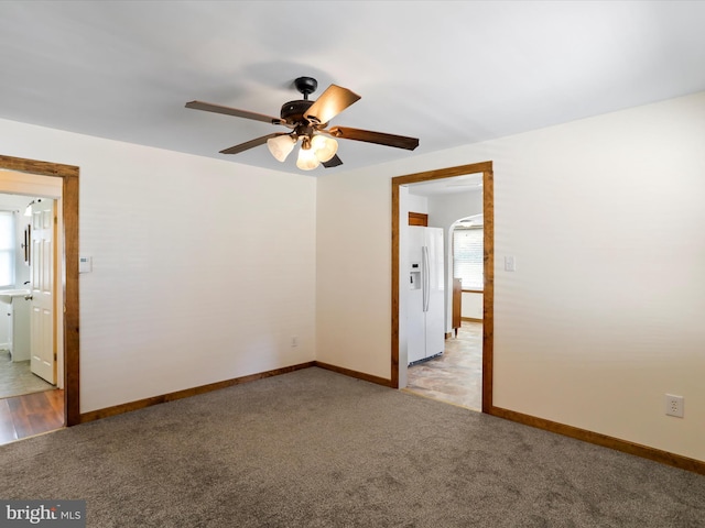 819 Manns Ter, Cumberland, MD 21502 - empty room with a ceiling fan, baseboards, light carpet, and plenty of natural light