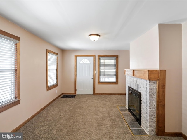 819 Manns Ter, Cumberland, MD 21502 - carpeted foyer with baseboards and a fireplace