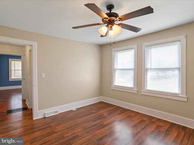819 Manns Ter, Cumberland, MD 21502 - unfurnished room with visible vents, dark wood finished floors, ceiling fan, and baseboards