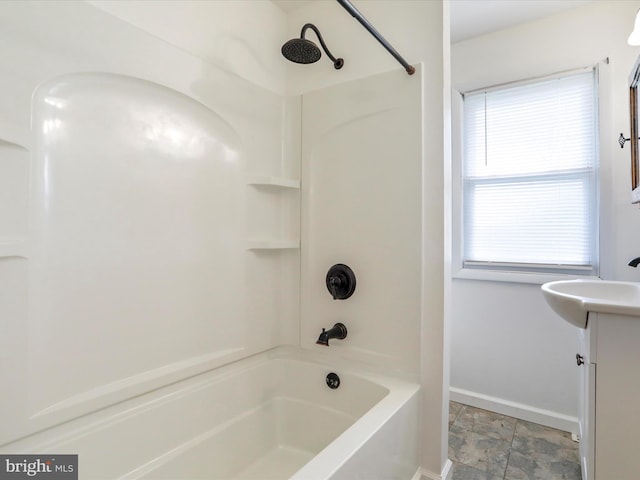 819 Manns Ter, Cumberland, MD 21502 - bathroom with baseboards, shower / tub combination, stone finish floor, and vanity