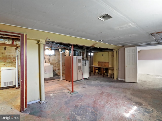 819 Manns Ter, Cumberland, MD 21502 - unfinished basement featuring water heater, heating unit, washer / dryer, and refrigerator