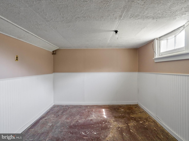 819 Manns Ter, Cumberland, MD 21502 - interior space with baseboards, a textured ceiling, and a wainscoted wall