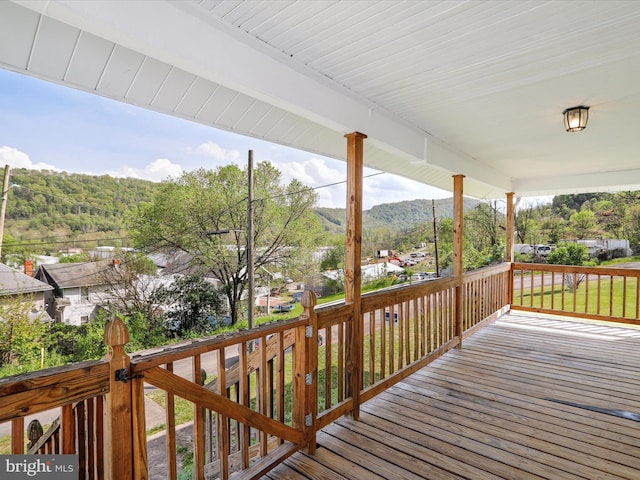819 Manns Ter, Cumberland, MD 21502 - wooden deck with covered porch and a mountain view