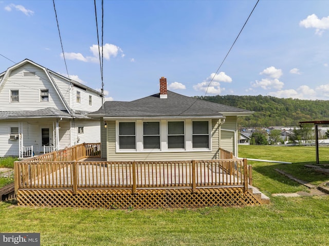 819 Manns Ter, Cumberland, MD 21502 - back of property with a lawn, a chimney, roof with shingles, and a wooden deck