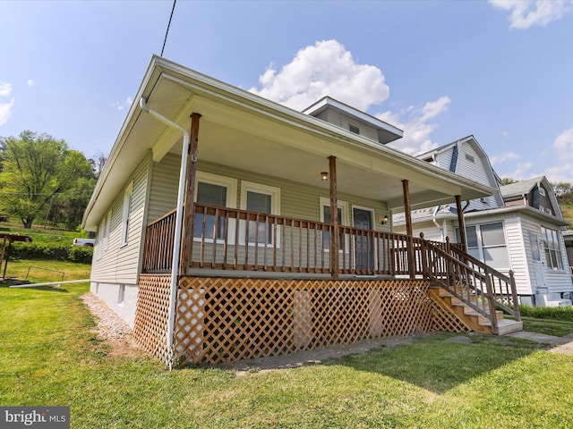 819 Manns Ter, Cumberland, MD 21502 - view of front facade featuring covered porch, stairs, and a front yard